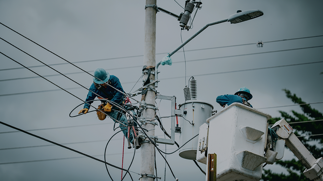 bucket truck with worker working on transformer